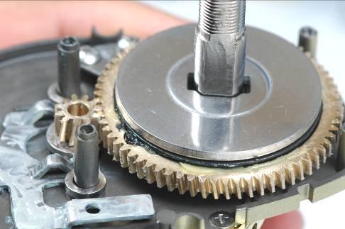 Re-install drive gear assembly with new drag plate (key washer).