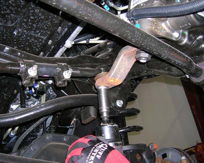 5. Next, remove the nut and lock washer from the sector shaft on the steering box and