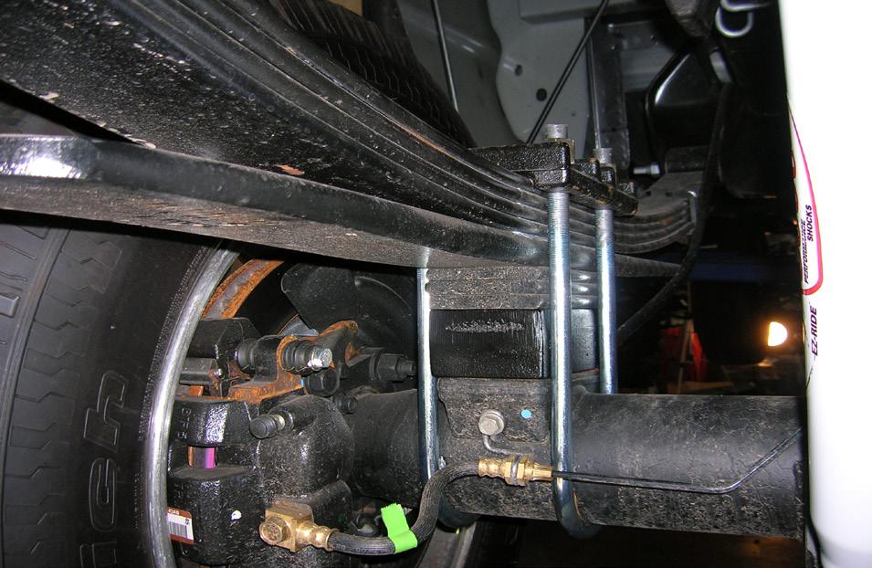 Remove both shocks from the vehicle and save the lower mounting hardware. 37. Working on the passenger side, loosen but do NOT remove the u-bolts. 41.