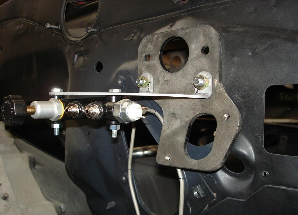 1. Install the line fittings into the proportioning valve Wilwood # 260-11179 Note brake line locations for