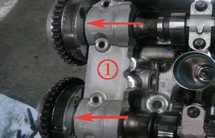 For 1st design shown below, visually inspect for teflon camshaft thrust washers being present between the camshaft actuator