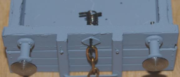 back of the back of the coupling hook and bend the tags over to secure the