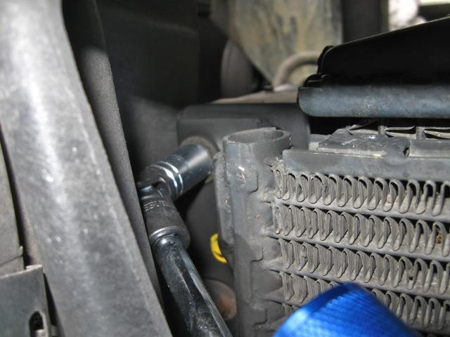 The position of these bolts between the radiator and the headlights makes it necessary to have a flexible tool.