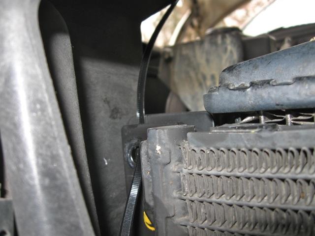extension from the outside. 18) tie wrap the condenser to the front rail of the car to support it and hold it in place.