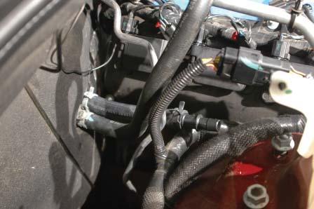 Use the stock clamp removed from the OEM heater hose removed earlier to attach the 7