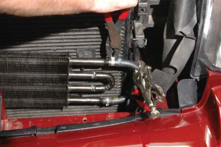 Set the power steering cooler aside for later reinstallation. 69.