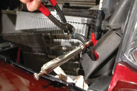 76. Flip the power steering cooler over so that the mounting tabs that were originally on the rear are now facing forward.