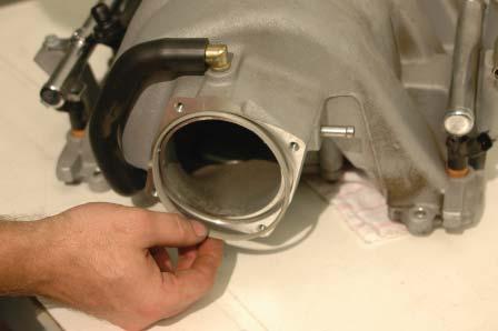 Remove the throttle body from the OEM intake manifold