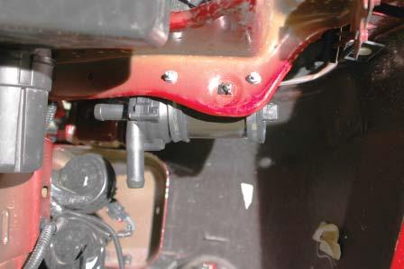 132. Secure the pump as described using the supplied nuts on the rear side of the fender