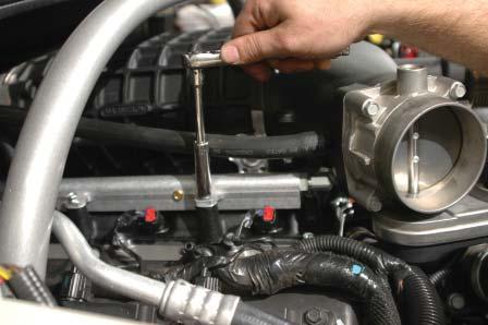 Route the hose up into the engine compartment on the passenger side and back toward the rear of