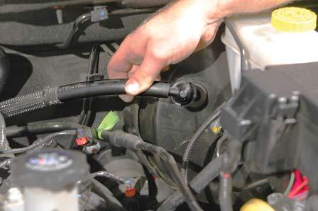 24. Disconnect the brake booster valve from the brake booster by pulling the