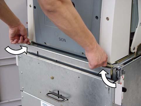 Turn the two locking levers at the withdrawable part to the inside in order to interlock the withdrawable