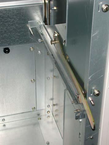 Operate the slip-on lever outside the panel to open the shutters: Push the handle down. The slip-on lever latches tight and the feeder shutter opens automatically.