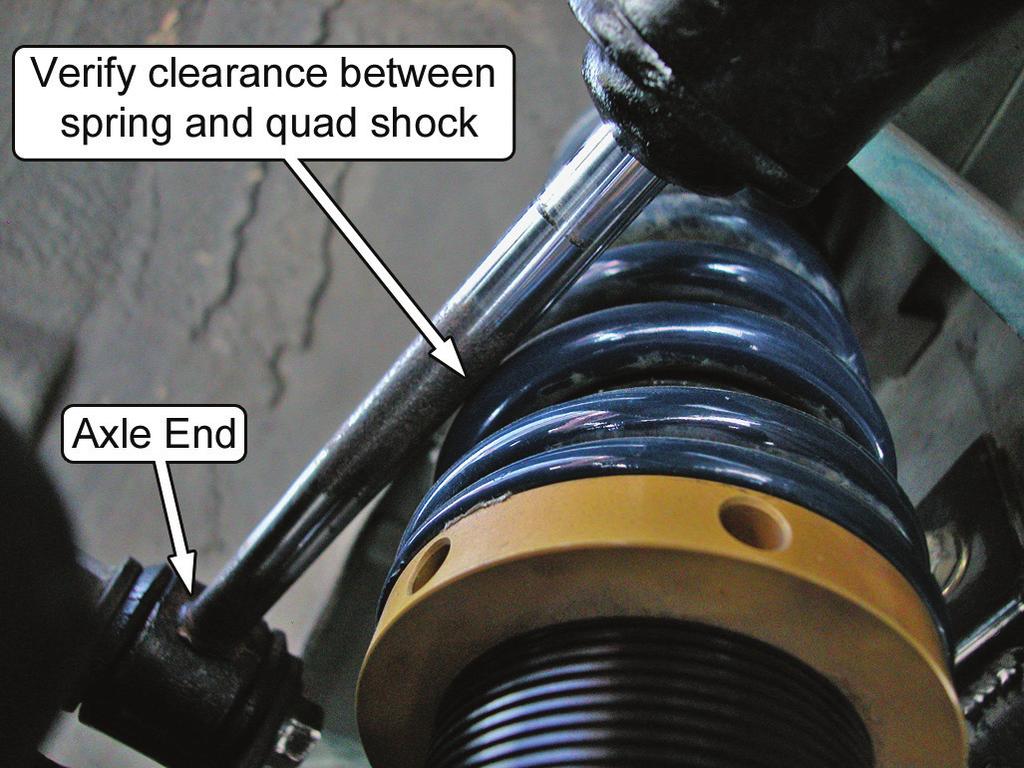 35. If the vehicle is equipped with quad shocks, verify that there is sufficient clearance between the outside of the coil-over spring and the quad shock piston rod.