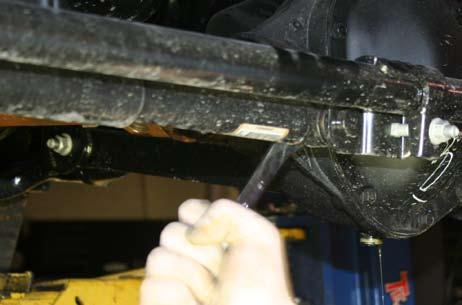 Remove drain plug from center section using a 3/8 ratchet and extension.
