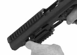 With the pistol pointed in a safe direction, pull rearward on the ACP Charging Handle and then let it go allowing the pistol to go fully into battery.