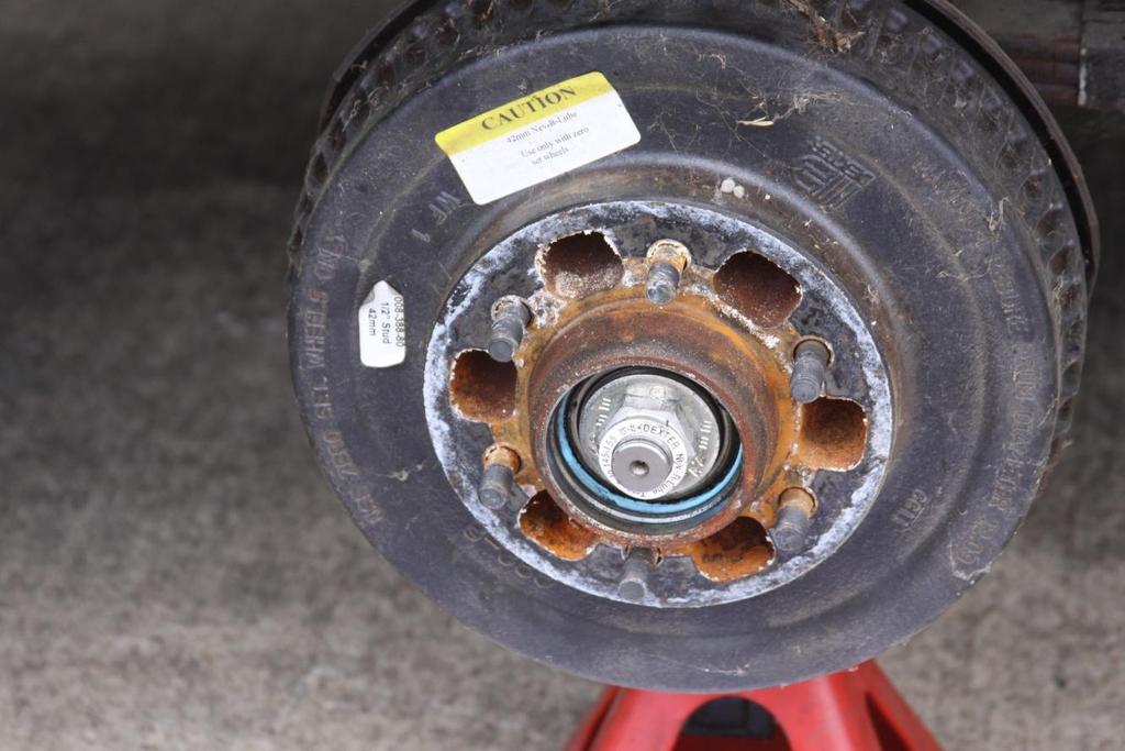 3. Once you have removed the wheels, I suggest that you take one axle down at a time. That way you have a reference in case any questions come up about what goes where.