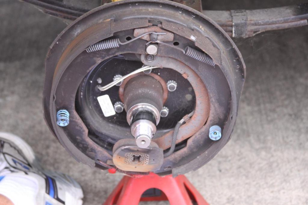 6. Install the new brake assembly on the studs