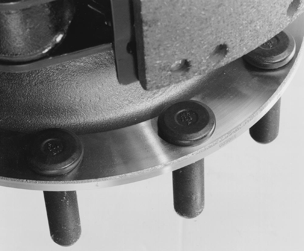 6. Check inboard side for either (1) a continuous smooth machined inner surface or (2) an inner surface with forging scallops between each wheel stud.