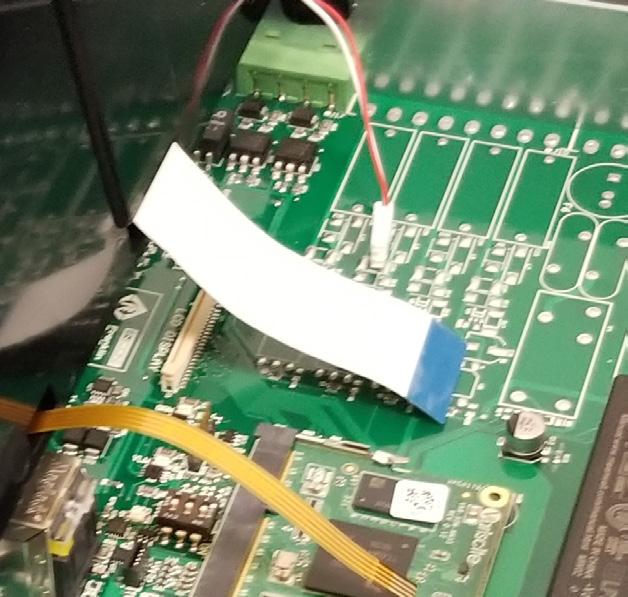 Remove the large, white ribbon cable from the LCD DISPLAY connector on