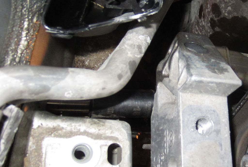 32. Lower engine again until lower bolt is accessible from below the