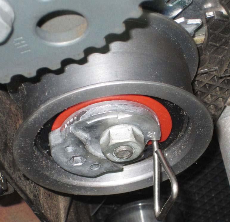 Using the T10264, rotate the tensioner counterclockwise until the pin hole can be seen.