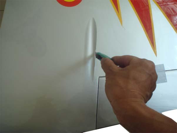 Use a hobby knife to remove the covering