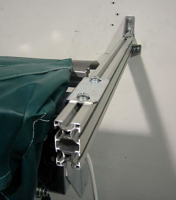 Photo #5 (Roll Tube Enclosure Installation) Secure the Roll Tube Enclosure brackets to the projection supports via the T-Nuts.