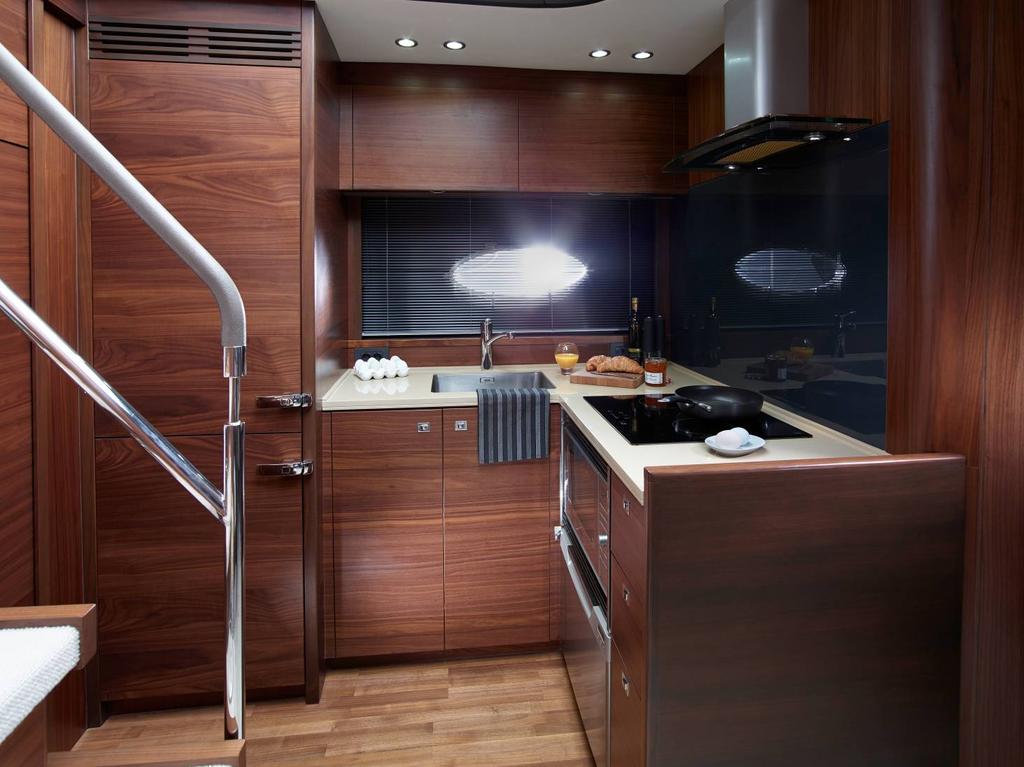 The galley floor is in a timber finish. Light oak flooring is specified with Alba oak interiors and walnut with walnut and Rovere oak.