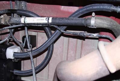10. Reroute wiring and reconnect canister. Install hoses as shown in Photo 7. Photo 7 CONGRATULATIONS!