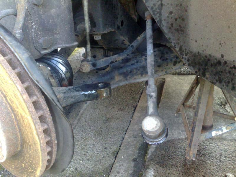 Undo the track-rod-end retaining nut using a 17mm spanner, again a liberal spray of WD40 will help, making sure you've marked the relative positions of the nut and the shaft BEFORE