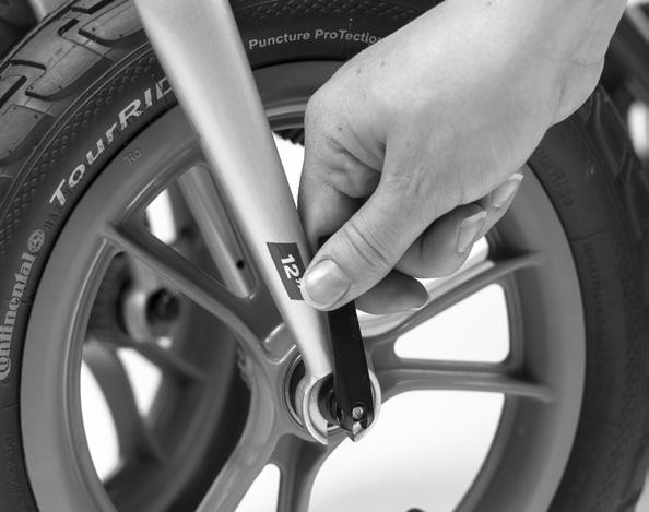 Detaching the Front Wheels 1. Open the quick-release on the front wheel by folding it outwards. 2.
