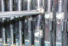 Loosen screw on needle bar boss. 3.