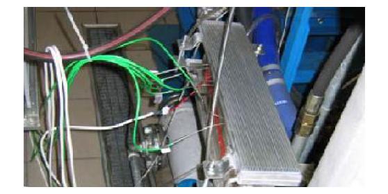 FIG.1:-Thermoelectric Generator Mounted On Exhaust System The exhaust pipe contains a block with thermo electric materials that engenders a direct current, thus providing for at least some of the