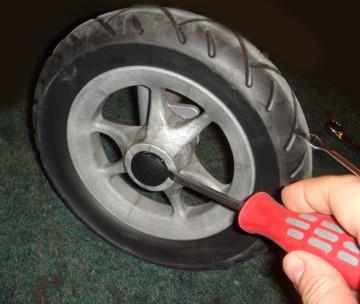 8.1: Rear Wheels Replace if damaged or worn. To change the rear wheel: Fig 8.1.1 Remove the wheel cap using a small screwdriver (see fig 8.