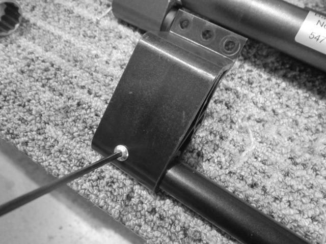Undo the 2 M4 screws securing the brake actuators to the brake bar using a hex key