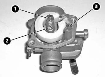 - Extract the screws from the carburettor bowl and extract the bowl itself, thereby gaining access to the bores: the maximum(1), minimum(2) and cold start