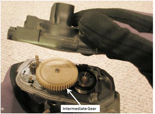 If the intermediate gear falls out and impacts a hard workbench surface or the floor, abort this procedure and REPLACE with a new throttle body assembly.