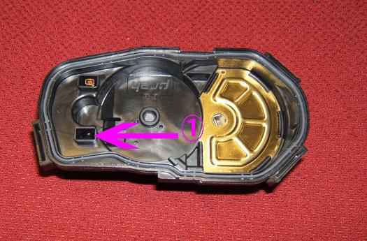 Observe the TP sensor cover for missing female throttle actuator motor terminals (1).