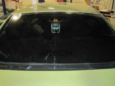 Step 10 (Rear Window): Begin by laying the rear window tint over the rear