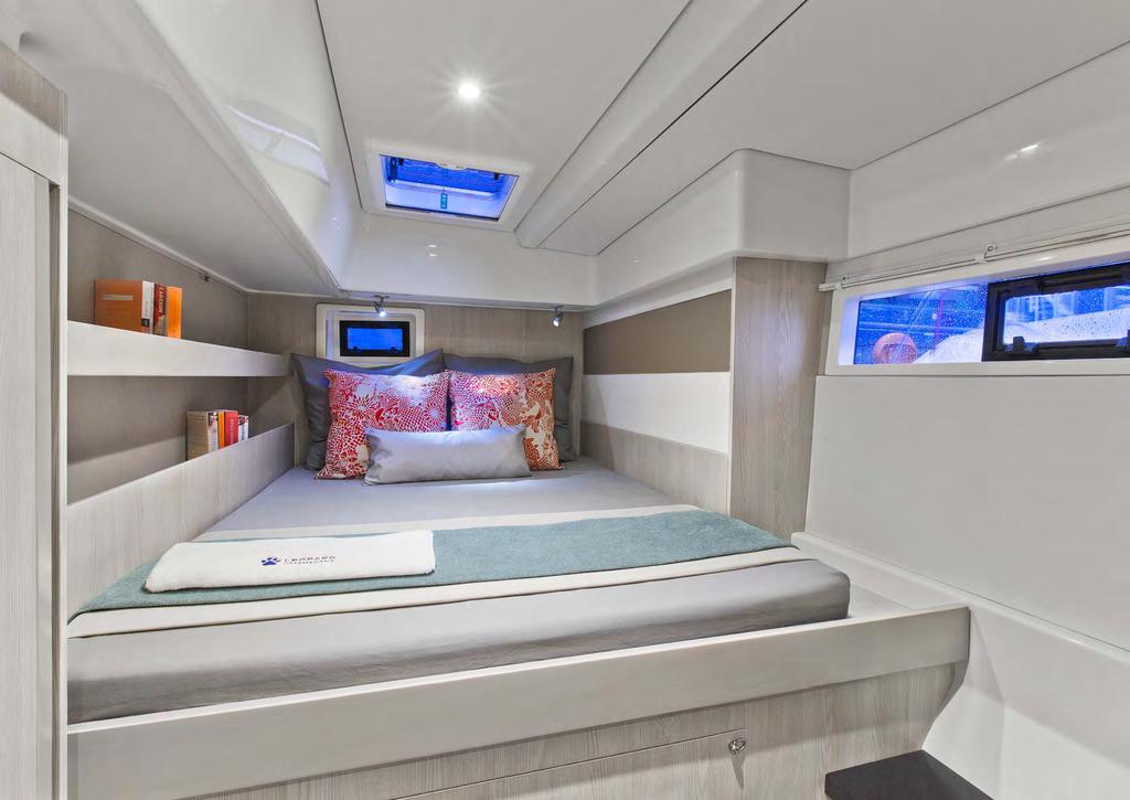 The choice of a three cabin layout features a master cabin in the starboard hull with a walk around queen-size bed.