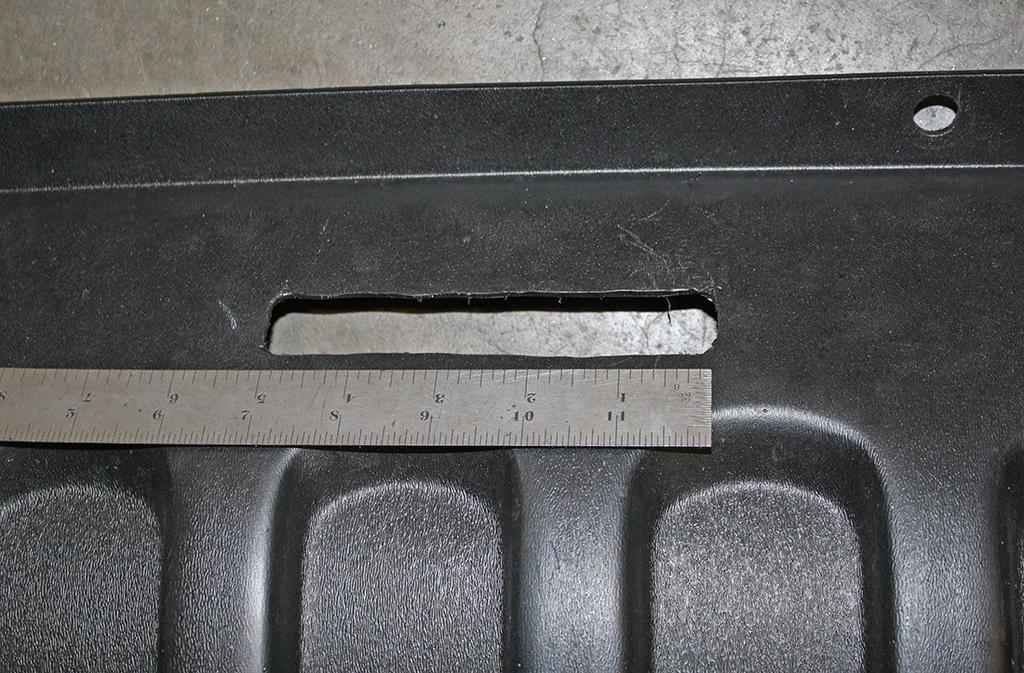 Measure over 3¼" from the first fastener, and then mark and trim a section that measures 9" wide by 5" tall, ensuring that you leave the two mounts attached (Fig.K red arrows).
