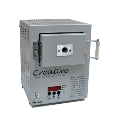 Instructions for the: Creative Metal Clay Kiln Technical Specification Volts: 220 V Amps: 3.2 A Watts: 700 W Temp. Control: Digital, Nine 8-step programmes Max. Temp: 1000 ºC Outer Dimensions: 22.