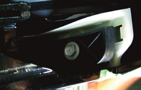Reach up from underneath the vehicle on the driver side to access the bumper cover electrical