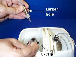 12) Install new bulb, aligning the larger hole toward the back of the tube with the G-clip hole. Do not touch bulb with bare hands (see Figure 16). 13) Re-install G-clip.