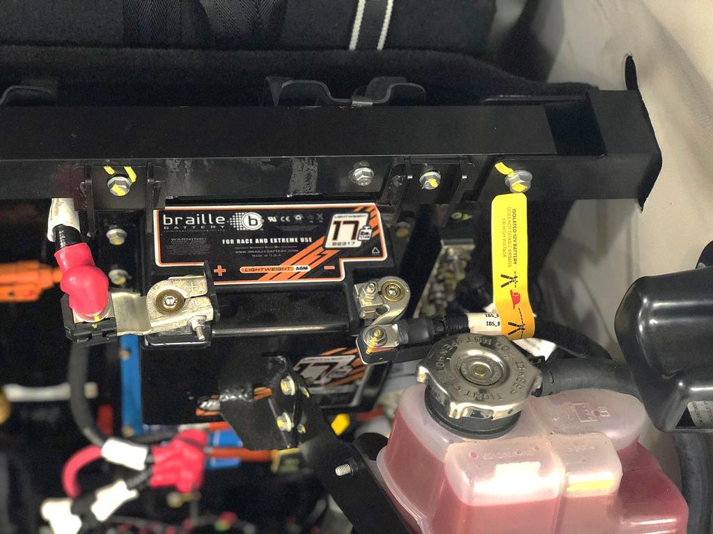 Disconnecting the Isolated 12 V Battery An additional isolated 12 V battery located in the trunk powers the self-driving components. To disconnect this battery: 1. Open the rear trunk (page 19). 2.