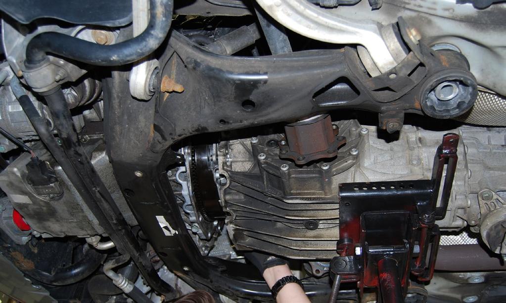 Make sure the transmission is fully seated, then re-install the transmission bolts.
