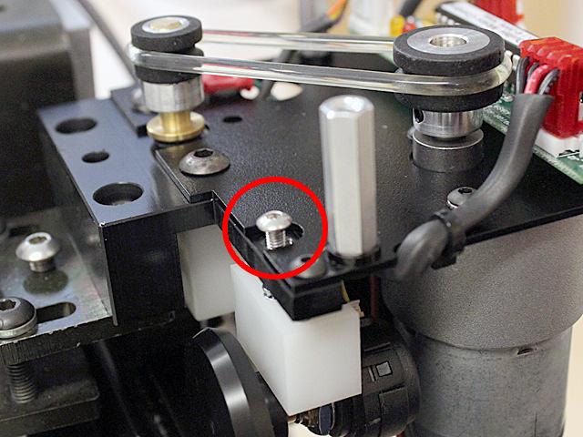 The top of the head of the sensor bracket limiting screw should be at