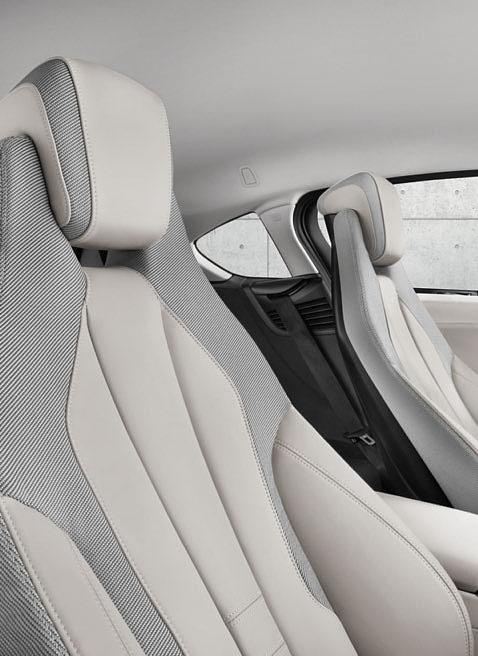 The upholstery in bright Carum Grey BMW i Spheric leather with Sitka cloth accent is offset with