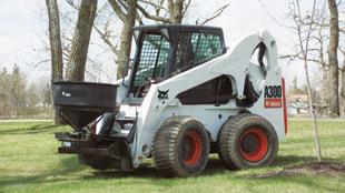 Mounts to skid-steer loaders and pickup trucks. Variable spread ing pattern from 4 to 40 feet.